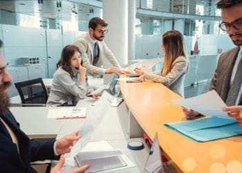 Bankers giving attention to businessman